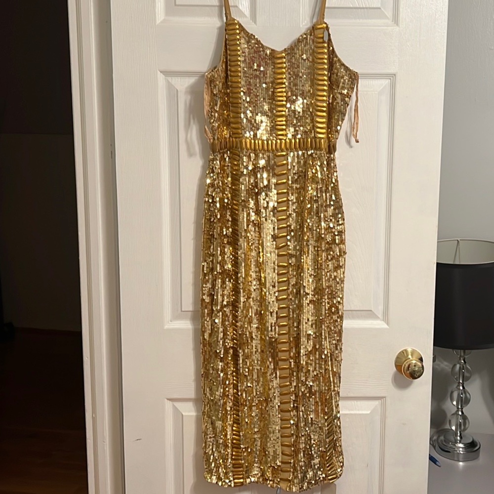 Virgos Lounge honor all over sequin gold dress.